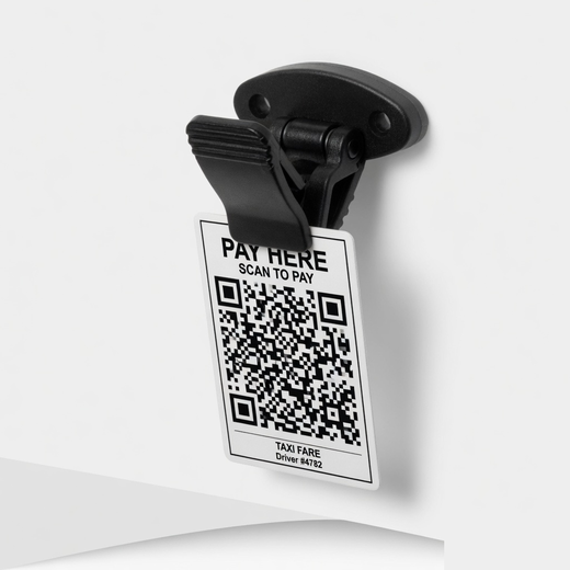 Black dashboard spring clip holding a compact Pay Here UPI QR card